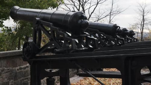 Close-up Quebec City iron cannon fortifications atop the historic stone ramparts