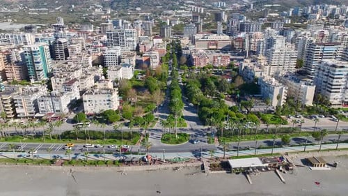 Aerial Video Aerial Perspective of a Busy Coastal Highway with Vehicles and Ocean Views