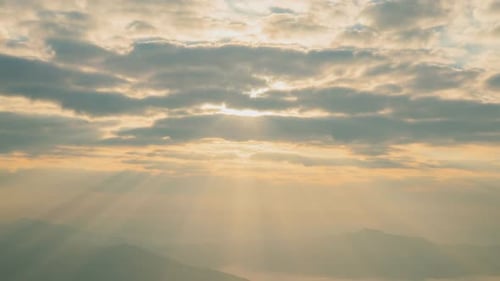 Majestic Sunrise Over Rolling Hills and Clouds