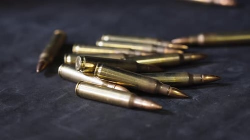 A single round of ammo rolls to the pile.