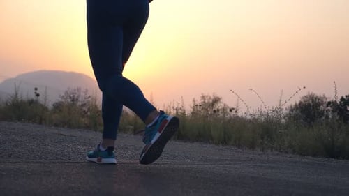 Follow to Feet of Young Girl Running at Country Road Female Leg Jogging in Nature Sporty Active