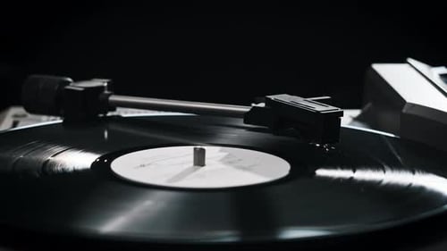 Record Player Needle Drops onto Vinyl Record