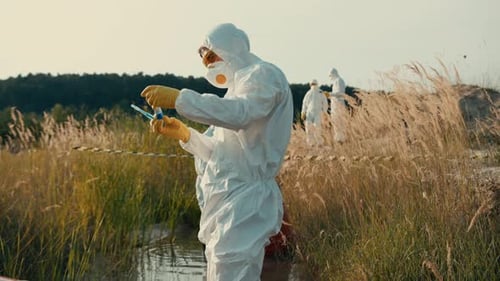 Researchers Wearing Hazmat Suits in a Polluted Environment