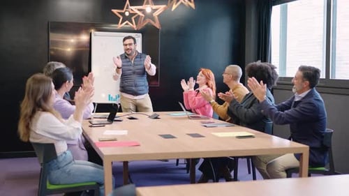 Diverse Team Applauds After Business Presentation