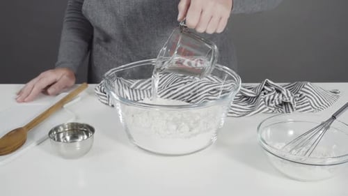 Mixing Ingredients in a Glass Mixing Bowl to Make Homemade Flatbread