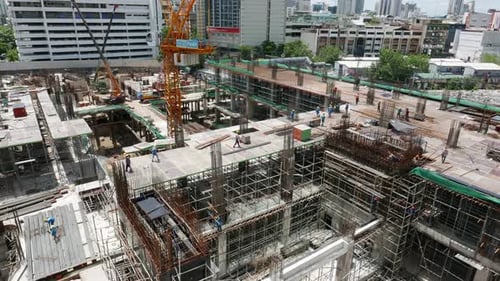 Large Building Construction Site with Multiple Cranes