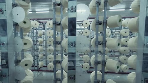 Industrial Machines Weaving Threads in Textile Factory