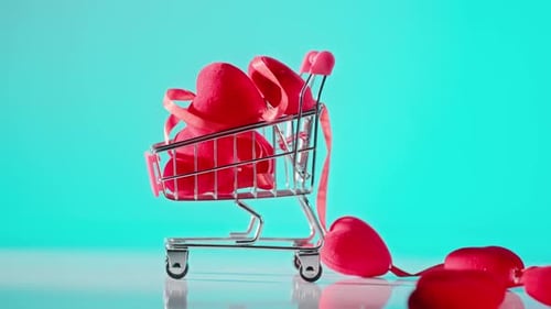 Red Hearts in Miniature Shopping Cart on Blue