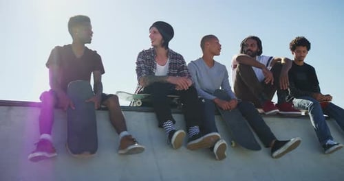 Friends, talking and men with skateboard in park for exercise, practice and hobby activity in city