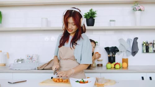 Happy Family Preparing Food Together at Home