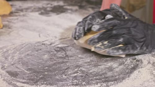 The baker works with the dough