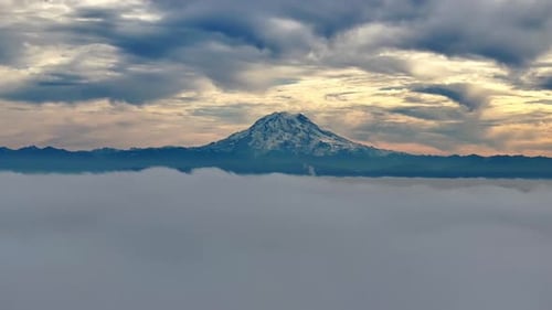 Mount Rainier Snowy Peak With Sea Of Clouds In Washington, USA. - aerial static shot
