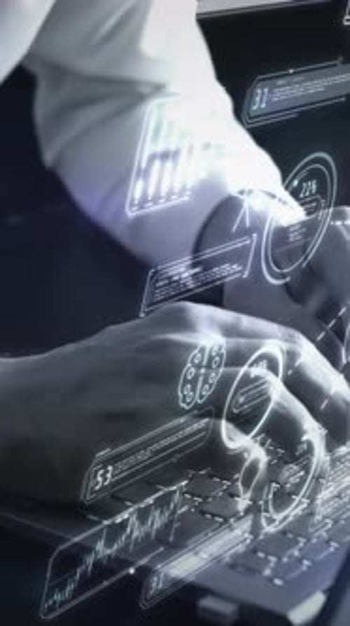 A Man at a Laptop Works with a Code