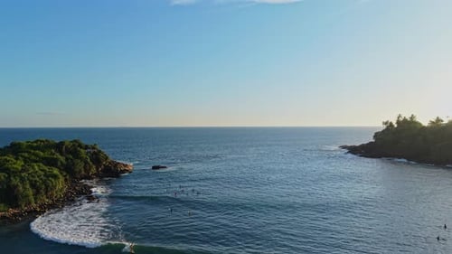 Aerial view over famous surf break in Sri Lanka at Hiriketiya beach