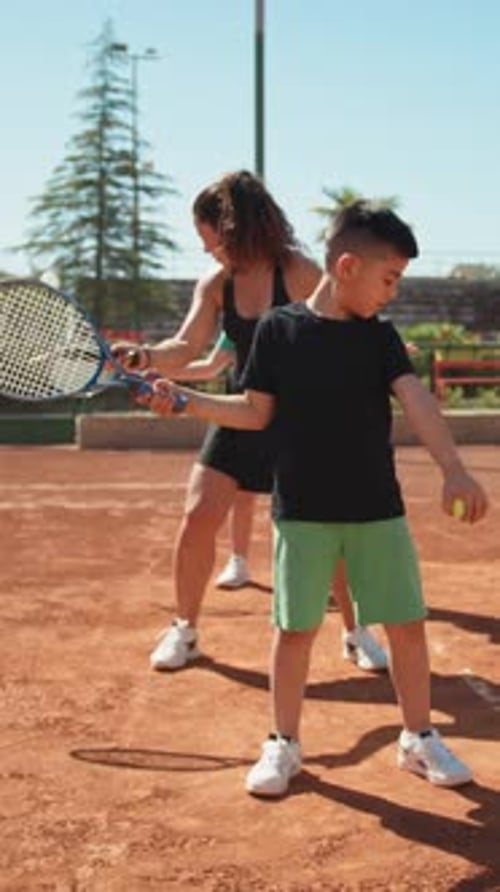 Tennis Teaching For Children In Outdoor Clay Court