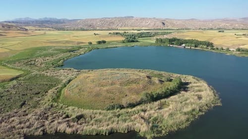 Aerial View Of Farmland, Lake And Hills