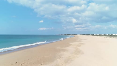 Aerial view flying over the iconic beach of Los Canos de Meca in Cadiz Spain