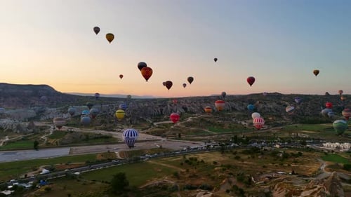 Colorful Hot Air Balloons Float Over Cappadocia at Sunrise, Turkey