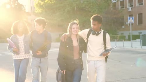Diverse group of college students walking together after class