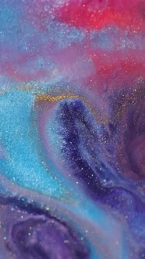 Shimmering Colors Mixing Artistically in Liquid