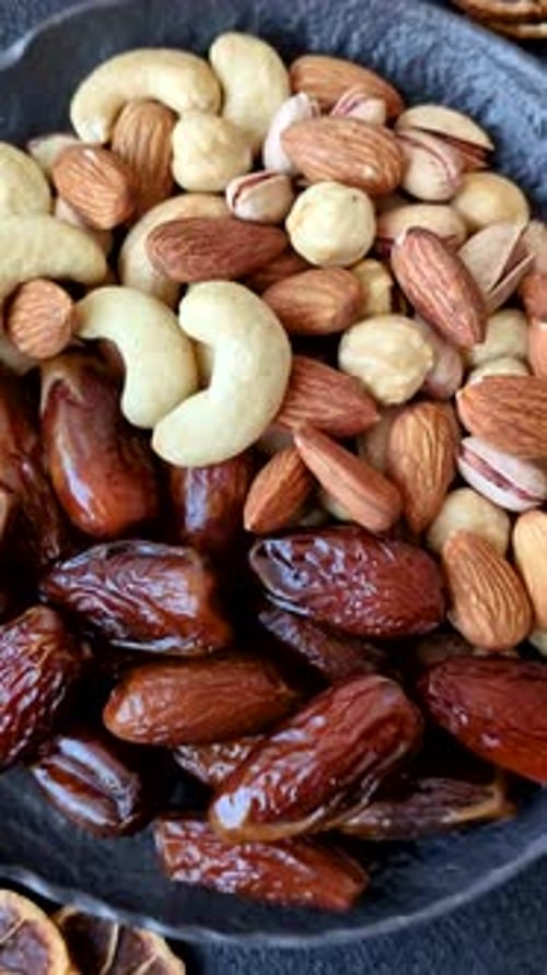 Dried dates on a ceramic plate for Ramadan or Iftar. Dates fruit as a background