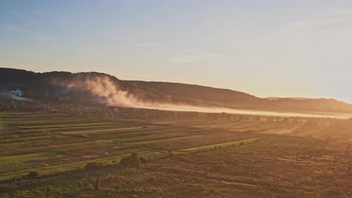 Sunrise Over Rolling Hills and Farmland