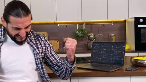 Excited Man Feeling Winner Success at Cryptocurrency Trading at Home