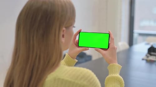Woman Holding Phone with Green Screen Chroma Key