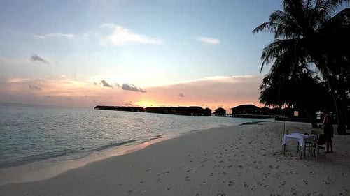 Sunset dinner table set up at the beach