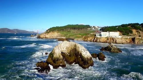 Drone View Of Choppy Ocean And Rocks By San Francisco Beachside