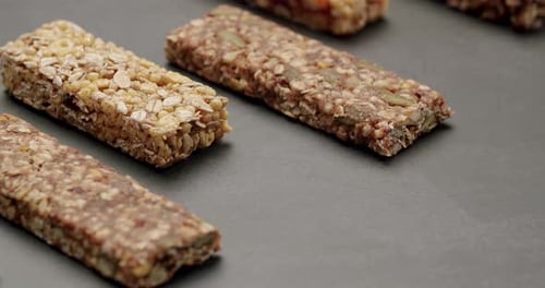 Assorted Healthy Granola And Protein Bars Arranged On Dark Background
