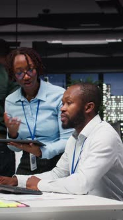 Vertical Video Black Company Advisors Doing Teamwork at Night to Meet Deadlines