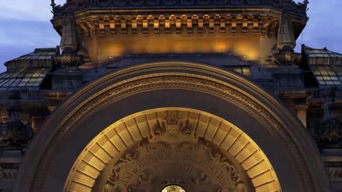Aerial drone view of the illuminated Palace of the Deposits and Consignments in the evening. Blue ho