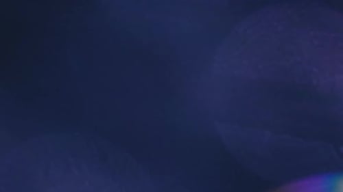 Abstract Lens Flares on a Dark Blue Background