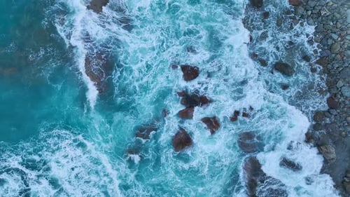 Aerial View Stormy Ocean Waves Crashing on Rocks at Sunrise Sea Texture and Power