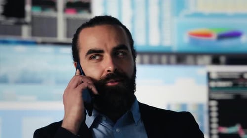Professional Man Talking on Smartphone in Modern Office