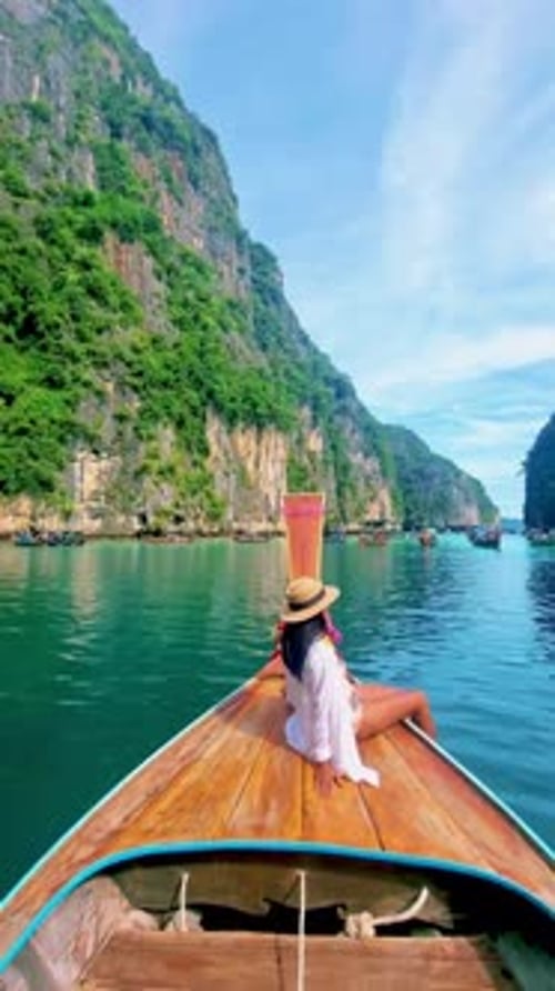 Pileh Lagoon with Green Emerald Ocean at Koh Phi Phi Thailand Women in Front of Longtail Boat