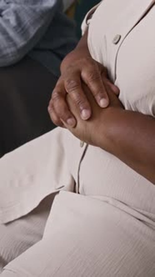 Close Up of Holding Hands for Comfort