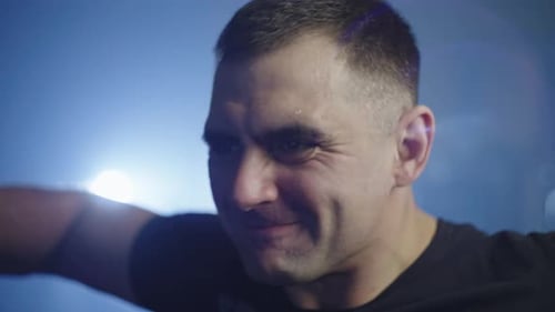 Closeup of a Caucasian Man Doing Sports in the Gym