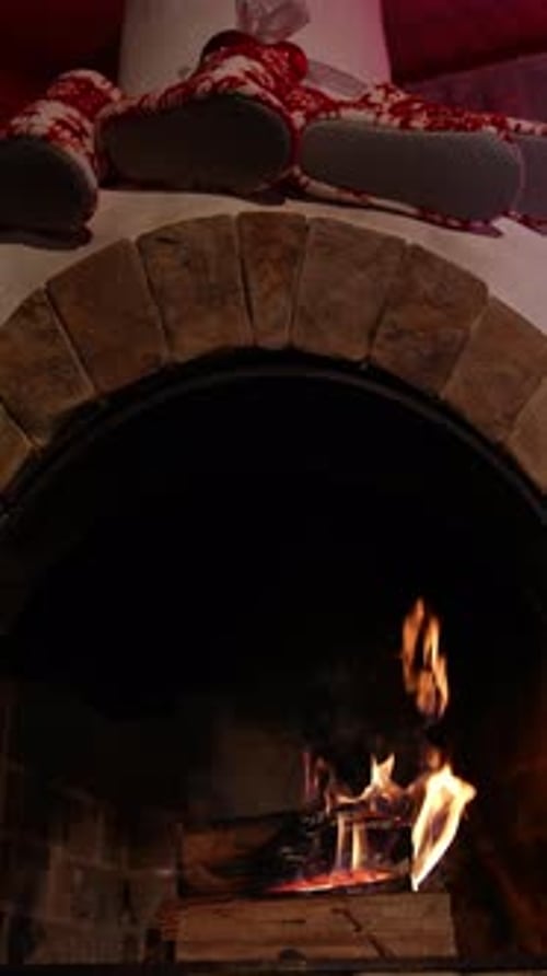 Burning fire in the fireplace. Low angle view of the fireplace with medium size flames.