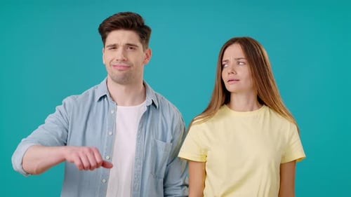 Young Adults Express Disapproval with Thumbs Down Gesture