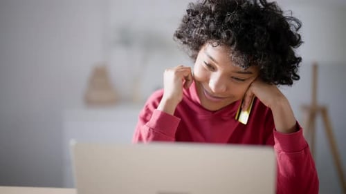 Young Adult Shopping Online with Credit Card