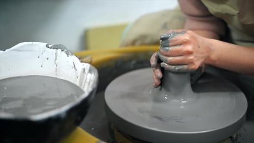 The master of sculpting pottery working in a studio. Shaping the clay