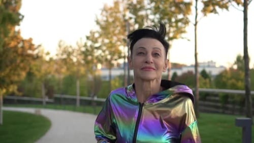 Active Mature Woman Runs in the Park and Goes in for Sports Slow Motion The Old Man is Running