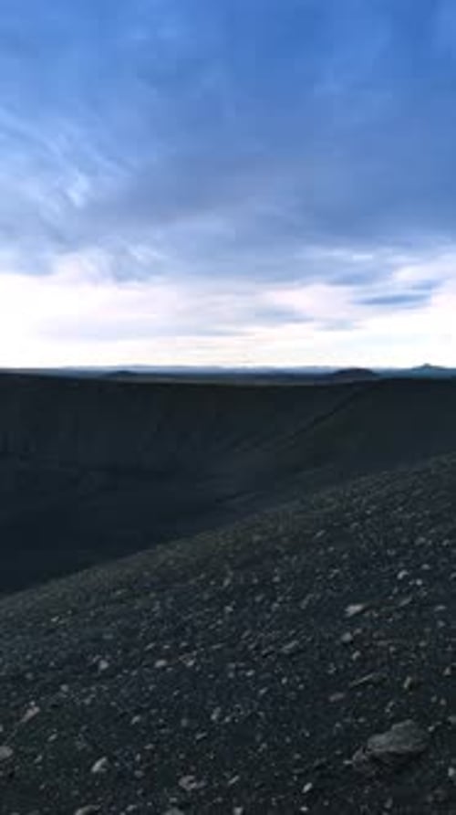 Black rocks of volcanic origin. Crater of a sleeping volcano in Iceland. Aerial perspective.