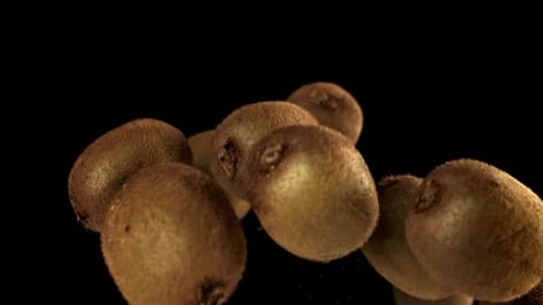 Kiwis Floating on a Black Background
