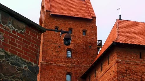 Red Brick Medieval Castle Architecture and Security Camera