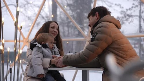 Family Together in Winter Dome Setting