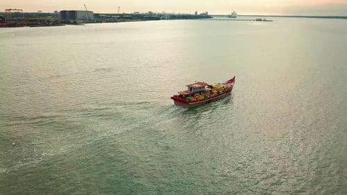 Sunset aerial view of Port Klang and a fishing boat