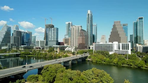 Aerial drone fly Austin Texas city downtown, Congress avenue bridge Traffic, Skyscrapers, Urban Park